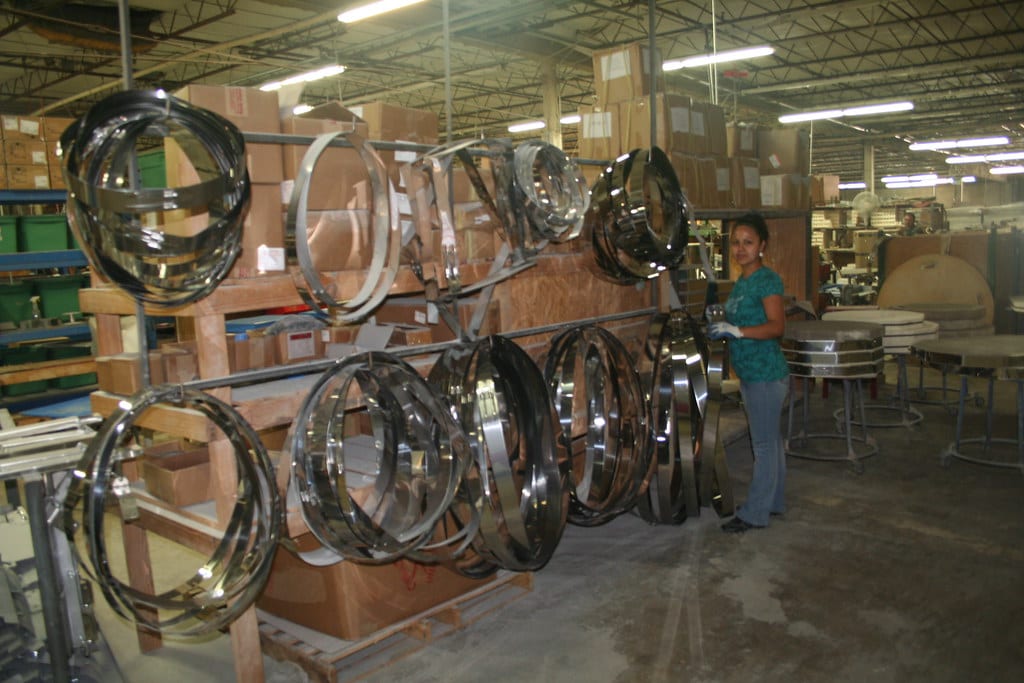 Stacked kiln ring bands on a manufacturer's assembly line