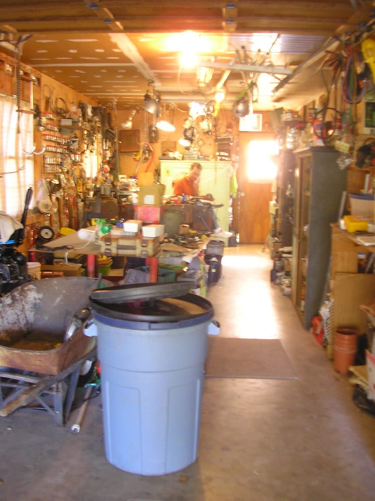 A home garage workshop with open floor space and a concrete floor