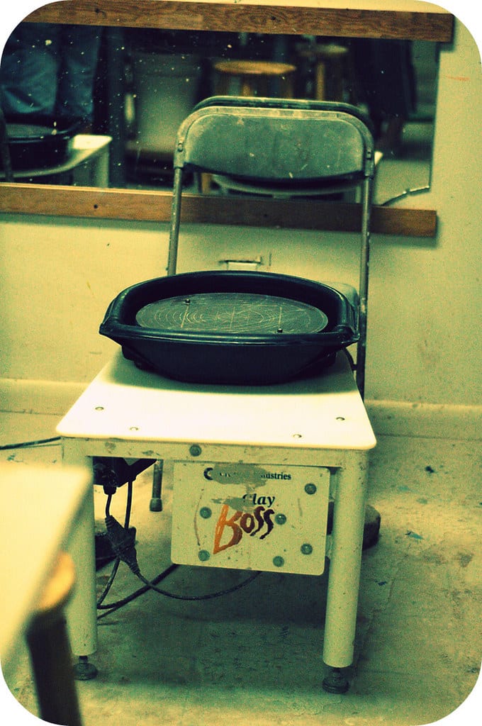 Creative Industries Clay Boss pottery wheel with its two-piece splash pan in a home studio
